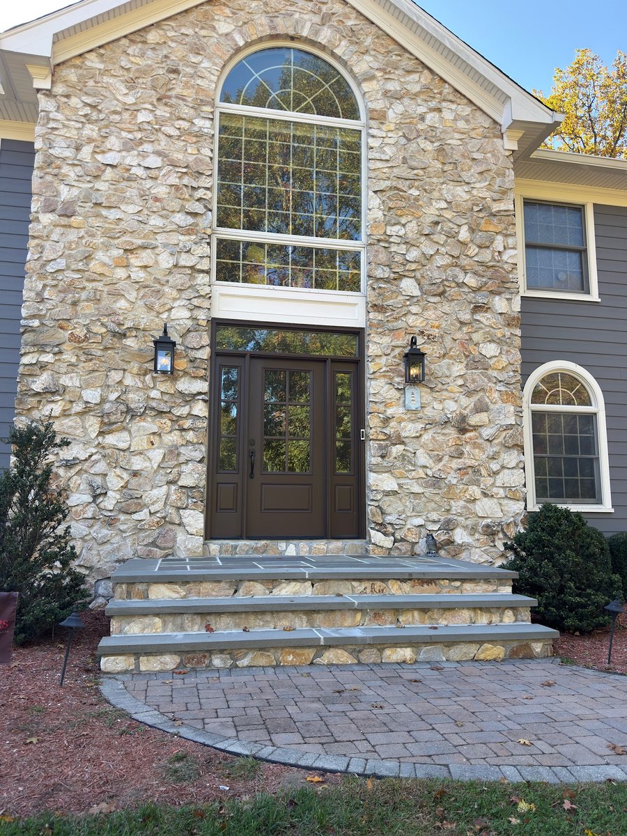 The same stone front steps in Bergen County, NJ, bare before the pumpkin install